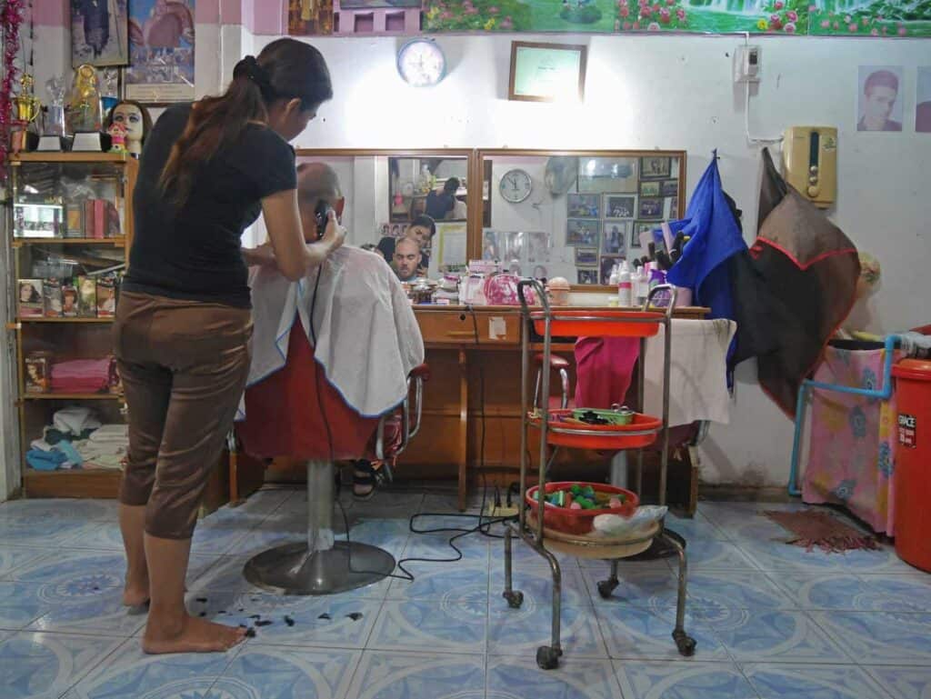 My partner getting a haircut in Hanoi, Vietnam.