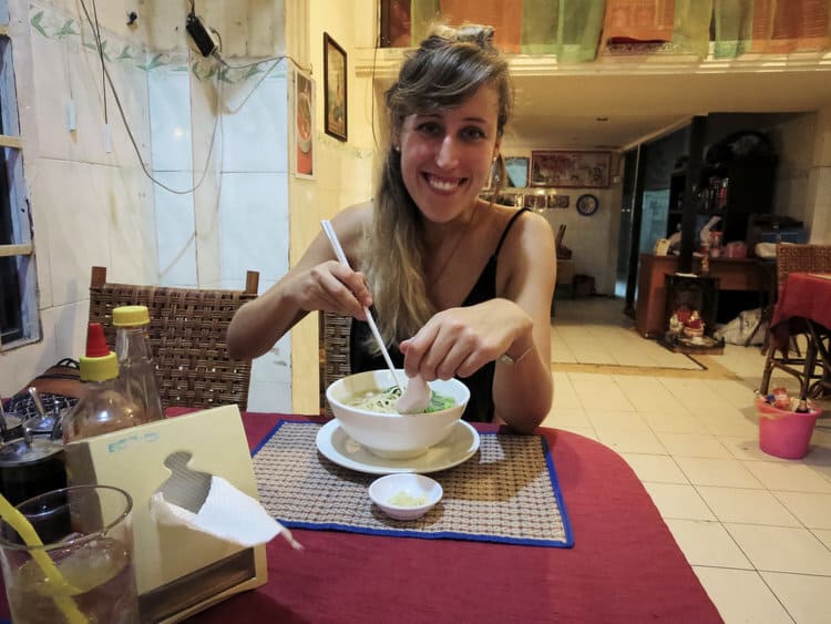 Eating a bowl of noodles in Phnom Penh, Cambodia