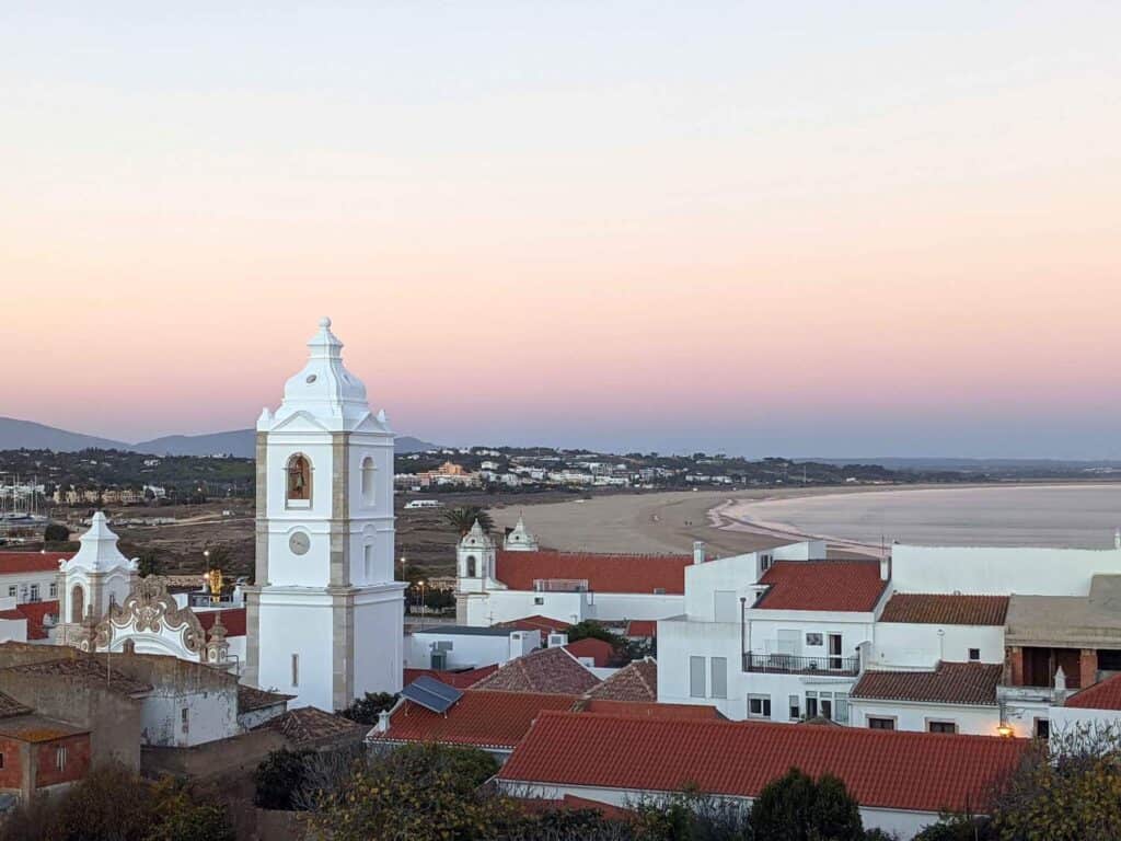 view of lagos buildings with sunset and ocean in the background during winter in portugal