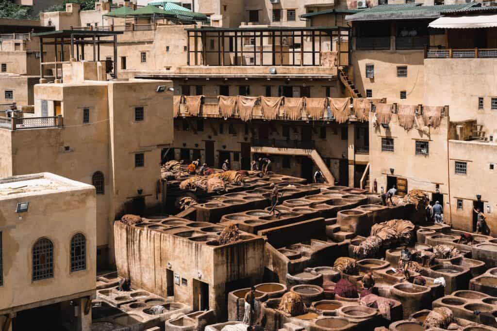 wide view of Chouara Tannery in Fes Morocco. if you're debating between Fes or Marrakech, consider whether you want to visit this historical place. 