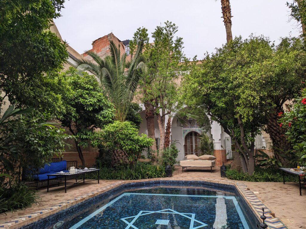 the garden and pool in riad laila, a riad in Marrakech. what not to do in morocco? don't skip staying in one of these traditional guesthouses