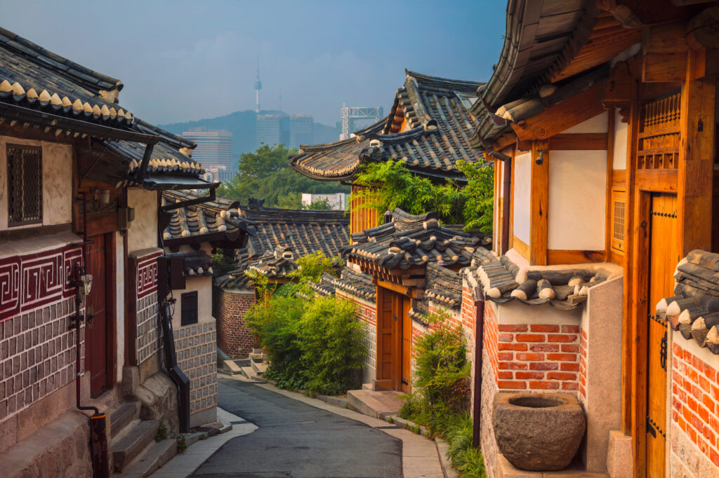 Bukchon Hanok Village on a sunny day in seoul, with the N seoul tower in the distance