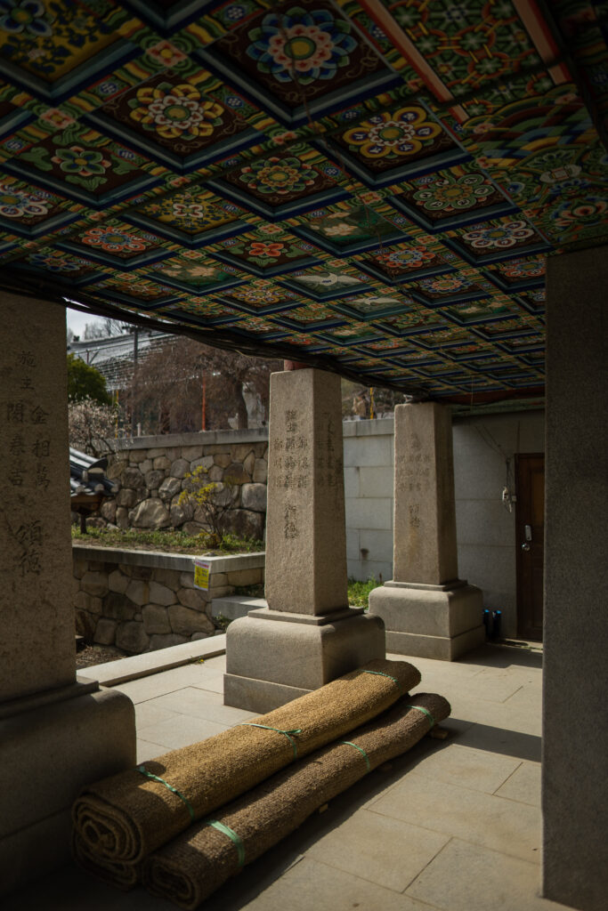 ornate, stone pillars in a temple in Seoul, korea