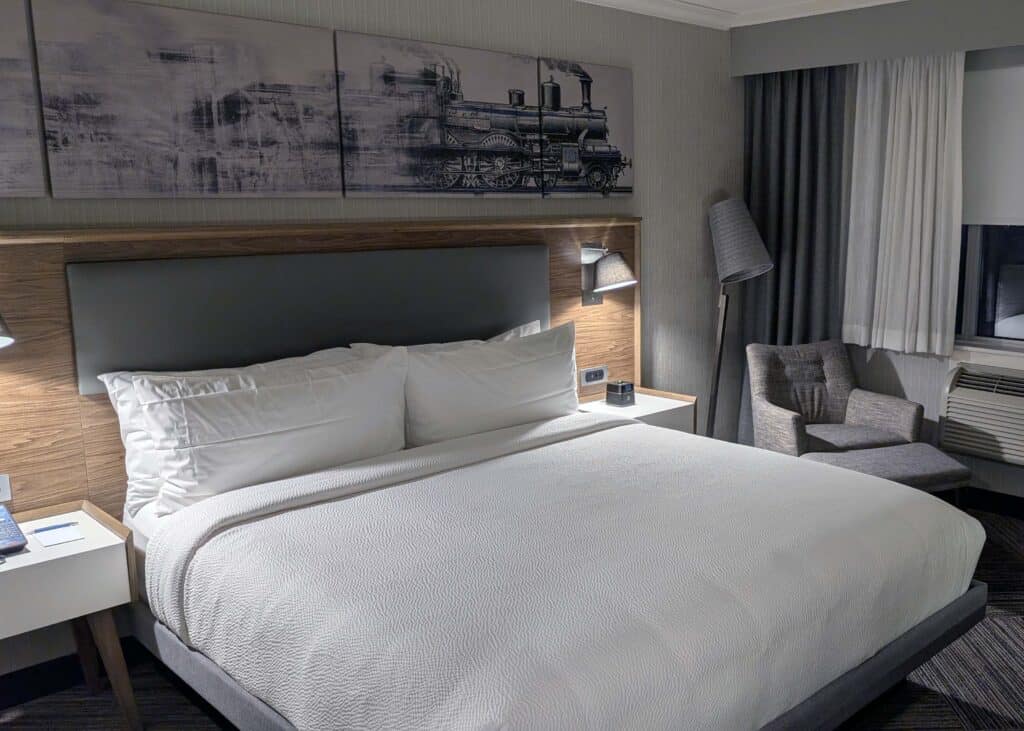 a king size bed in a room at the Four Points by Sheraton – Windsor Downtown