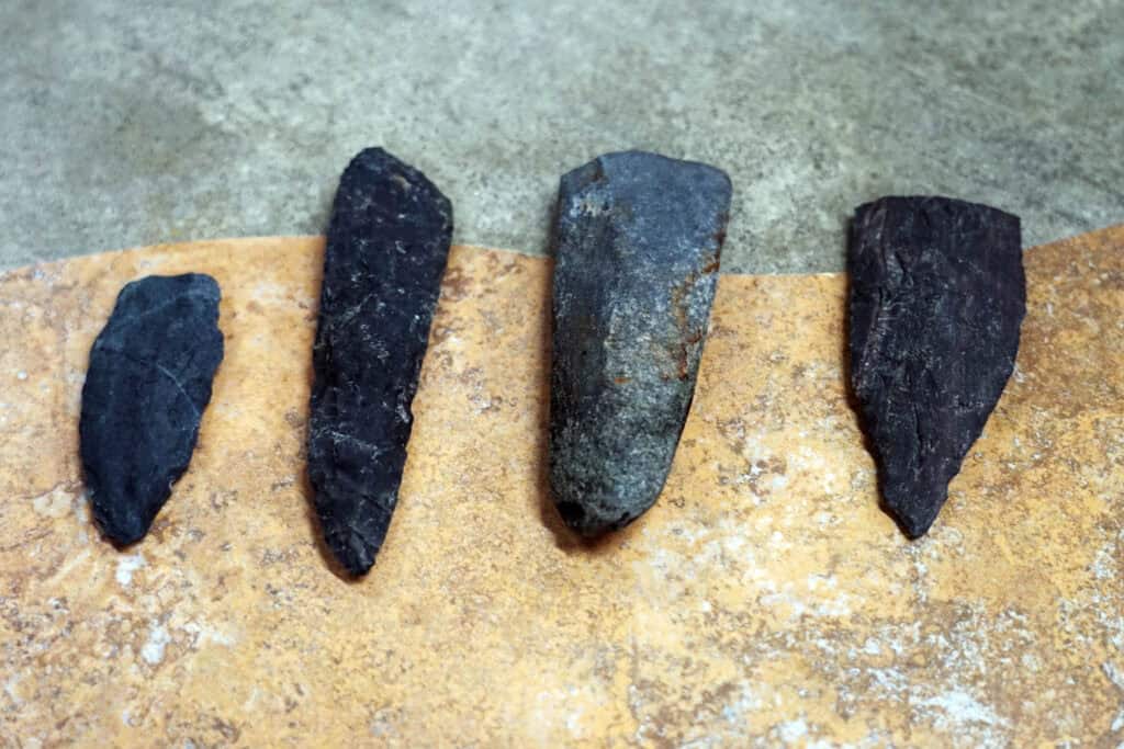 Ancient stone tools and tool fragments made from rhyolite, discovered at The Beaches Archaeological Site in Hare Bay, Newfoundland.