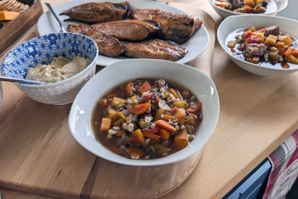 Homemade lunch featuring moose soup, smoked mackerel, fresh bread, and homemade spreads served at Paul and Joanne's home in the Exploits Islands.