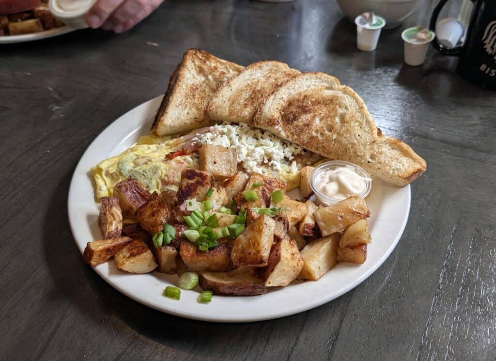 Greek omelette with feta, home fries and toast served at Rooster’s Bistro in Thunder Bay.