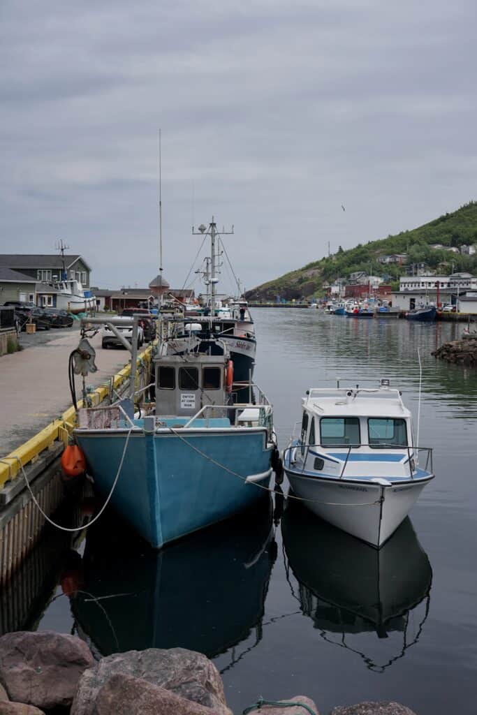 Fishing boats moored at the wharf in Petty Harbour, Newfoundland and Labrador.