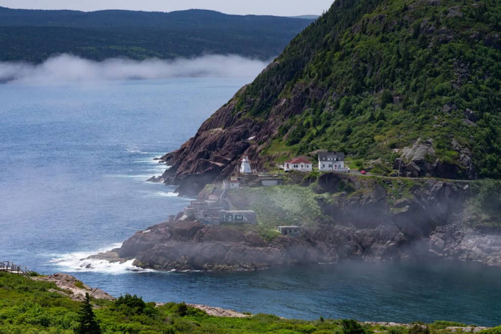Fort Amherst Lighthouse and buildings along the rocky coastline at the entrance to St. John’s Harbour, Newfoundland.