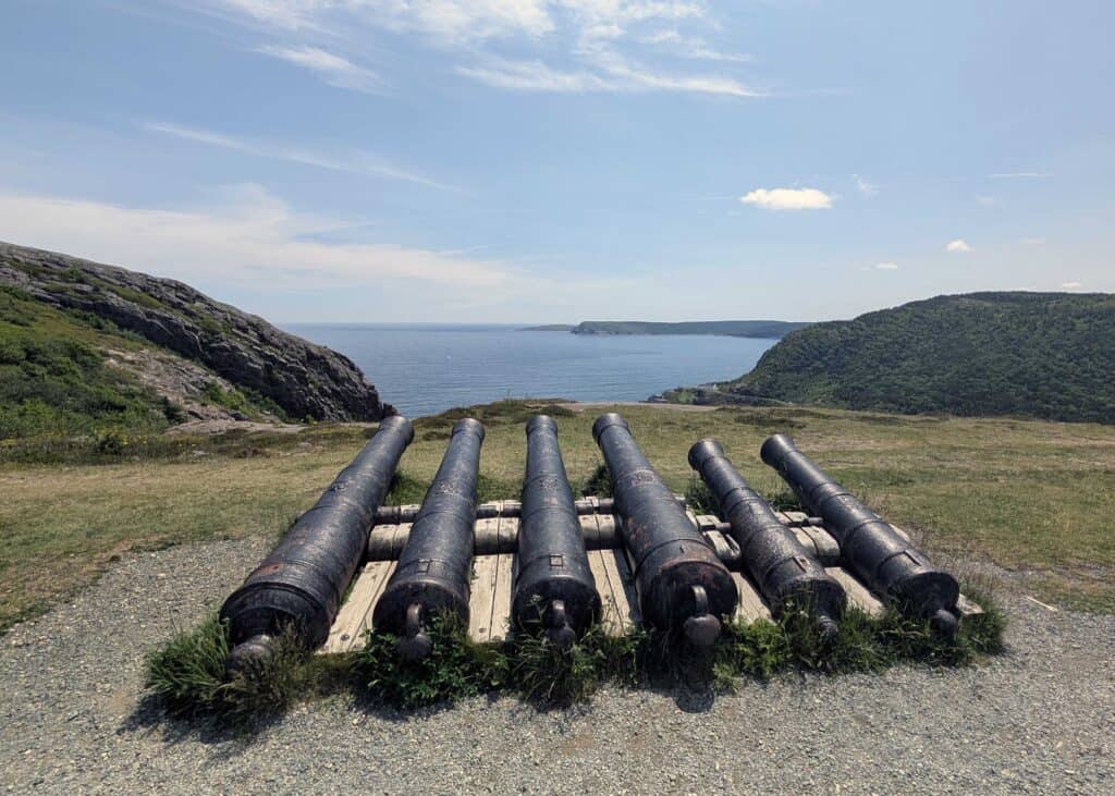 Six historic cannons at Signal Hill overlooking the coastline and Atlantic Ocean in St. John’s, Newfoundland.